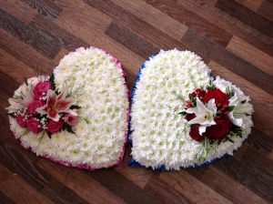 beautiful hearts made with white chrysanthemums  with red, pink roses and lily courage hand made by our florist in shop with fresh flowers we can offer local delivery to .darlington s l