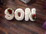 son  fresh flower tribute made lovingly in our little flower shop  dad is made from white chrysanthemums and red single carnations . 33 bondgate darling ton local and surrounding areas   