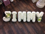 Name  letters frame carnations fresh flowers  fresh or artificial  floral teddy bear funeral tribute made lovingly by hand in our little shop with fresh flowers in 33 bondgate darlington local free deliver