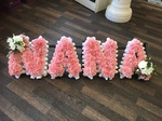 nanna/nana letters frame carnations fresh flowers  fresh or artificial  floral teddy bear funeral tribute made lovingly by hand in our little shop with fresh flowers in 33 bondgate darlington local free deliver